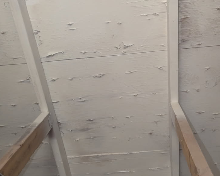 Attic roof sheathing clean and sealed white after mold remediation